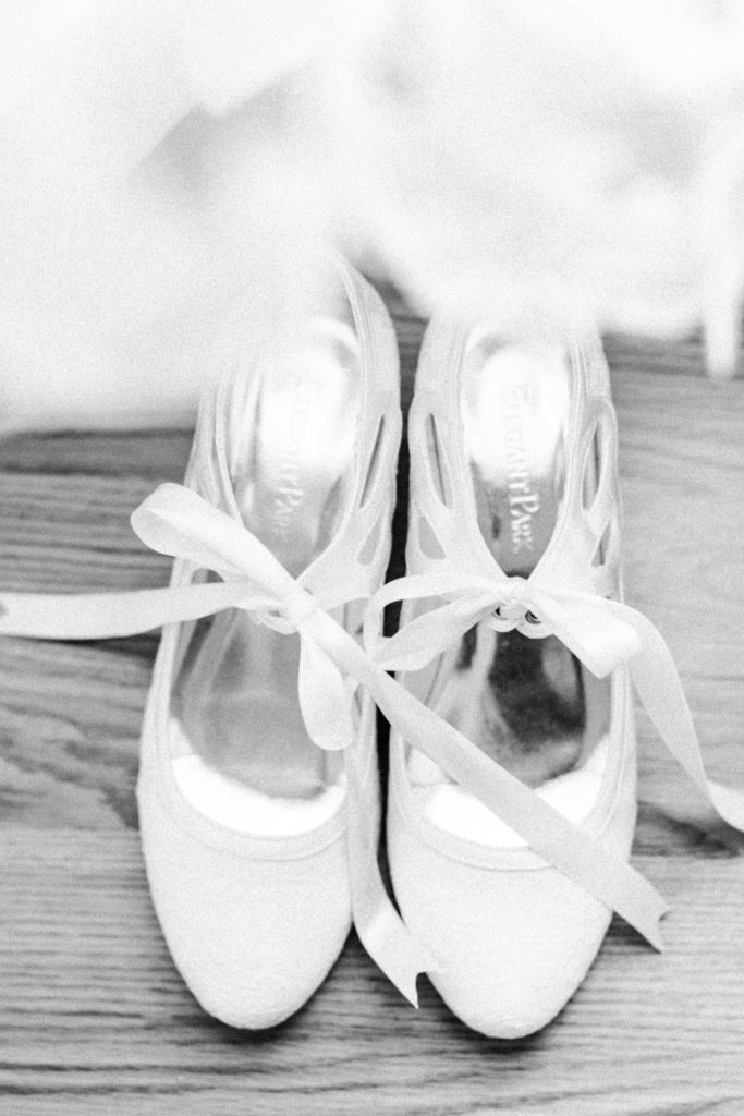 Wedding bridal shoes with a bow in black in white