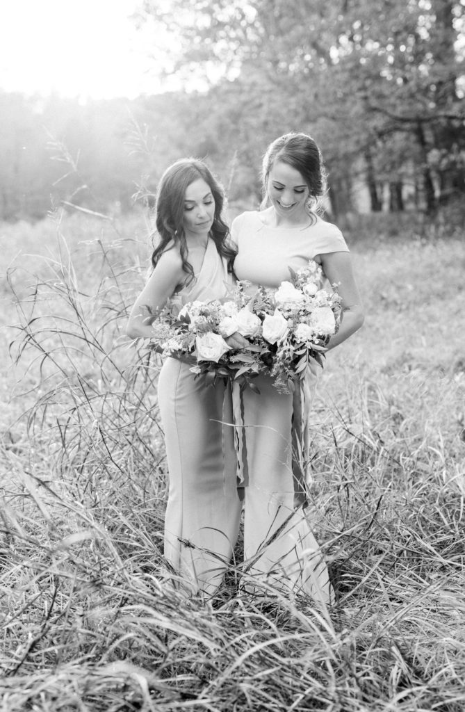 Black and white bridesmaids in a field