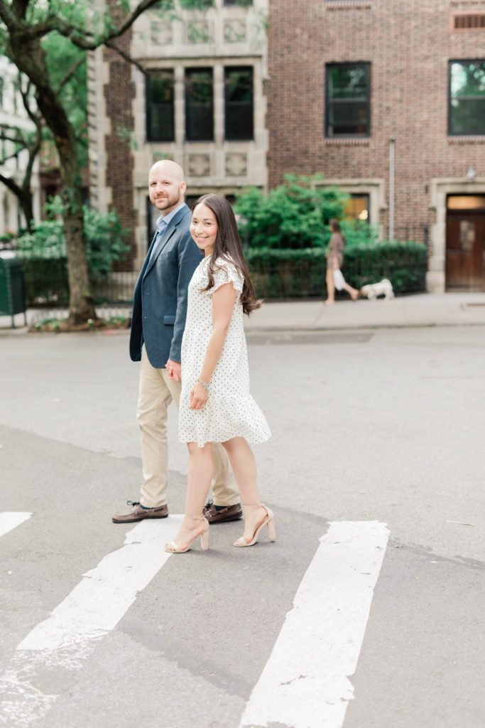 Couple cross the street in Brooklyn Heights