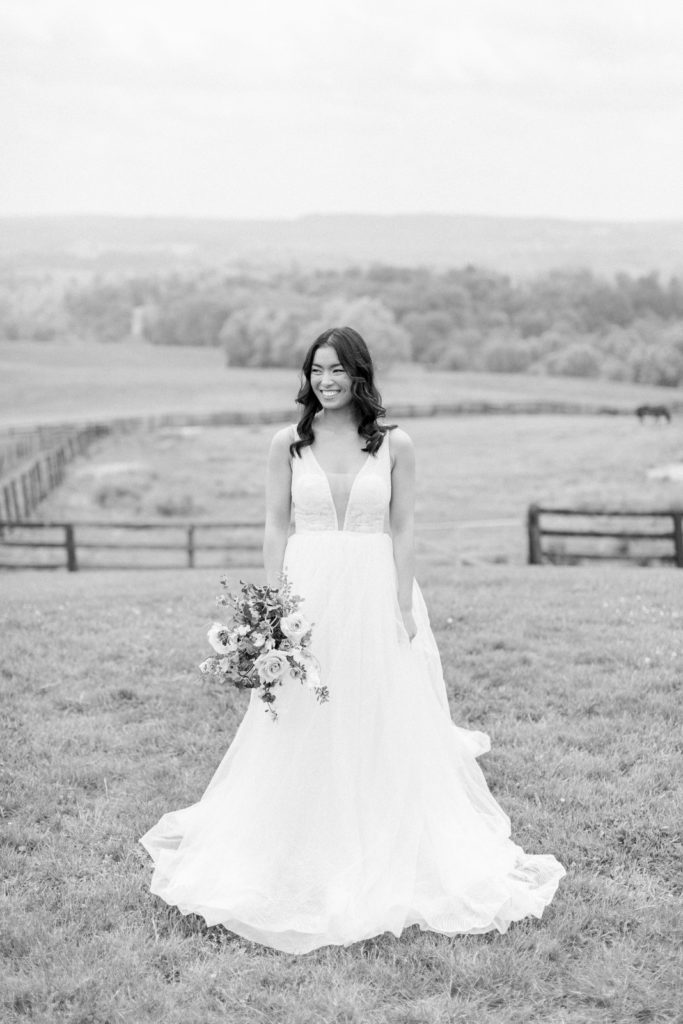 Bride stand facing the rotunda at lauxmont farms