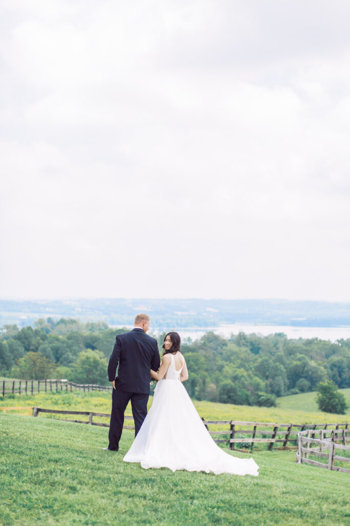 Bride and groom stand on hilltop at Lauxmont Farms in Wrightsville PA