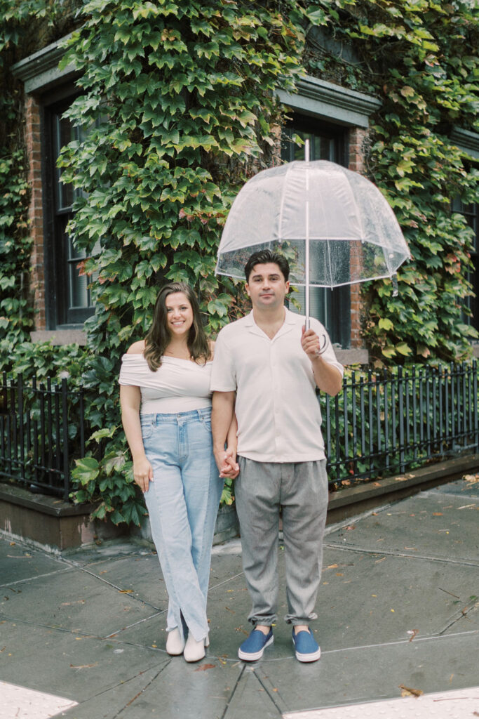 Couple stand on the corner of W. 11th street in NYC