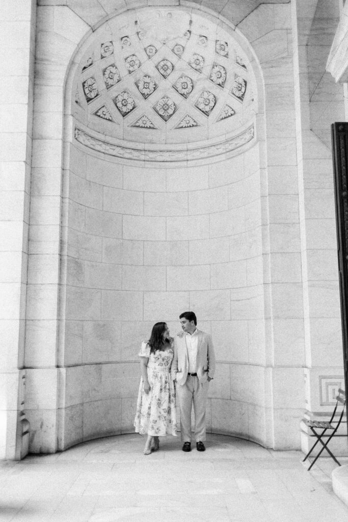 Couple pose at the New York Public Library